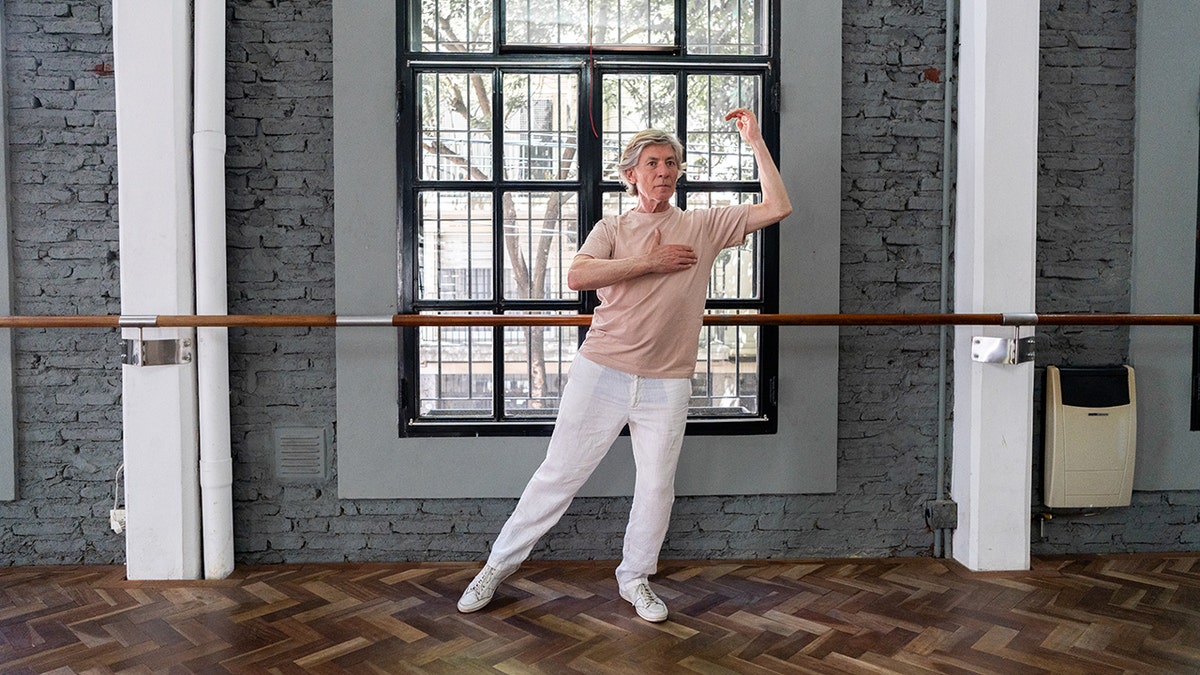 Senior practitioner tango in a dance studio